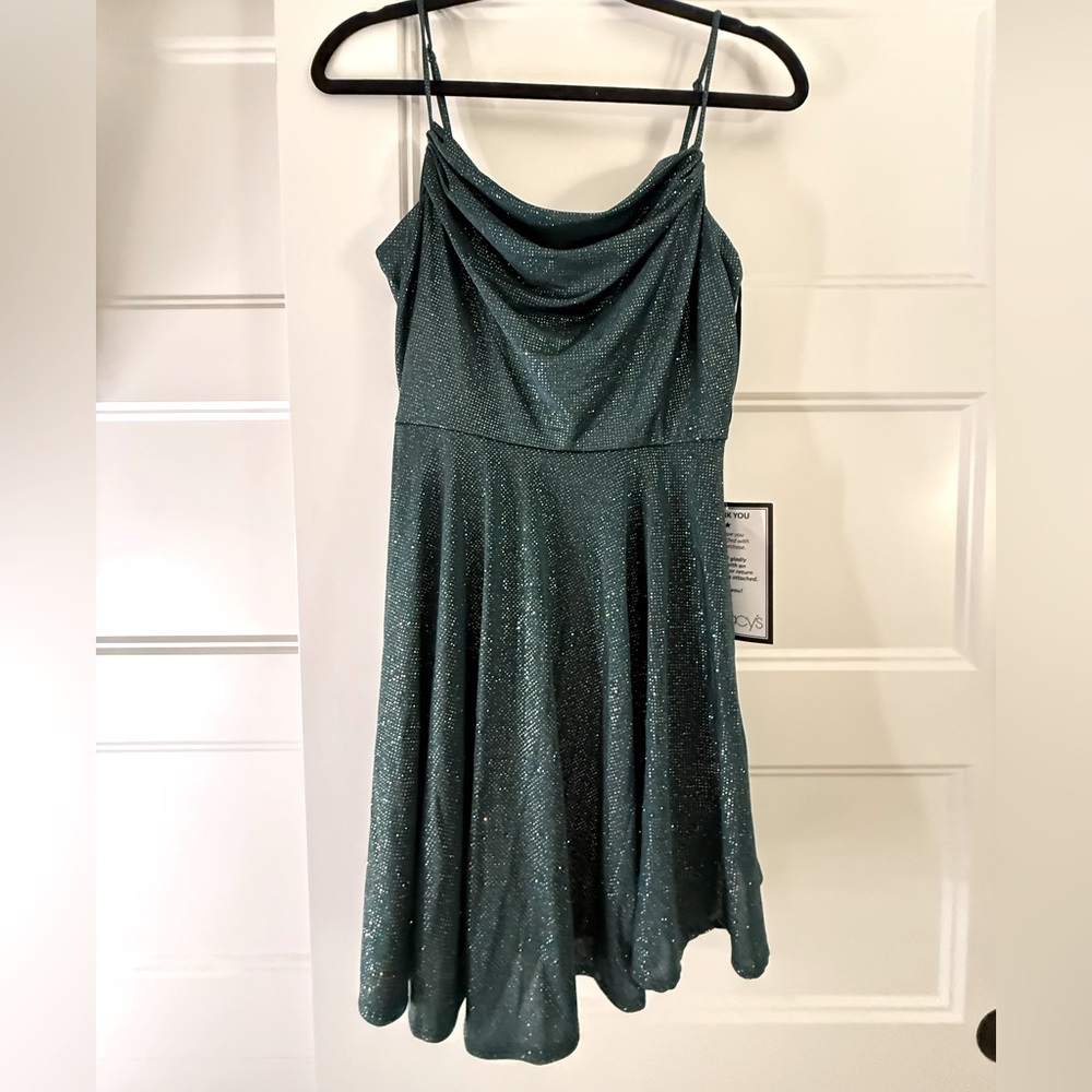 This is a “City Studio” homecoming dress in emerald green. Size 11/12. BRAND NEW